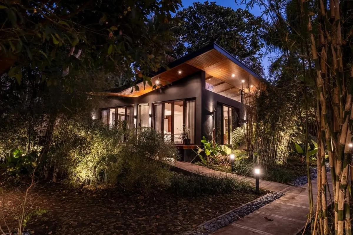 Cabin among bamboo trees with evening ambiance lighting